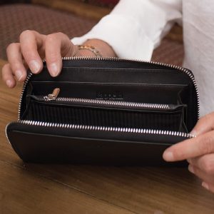 Emilia black soft leather purse open lifestyle shot