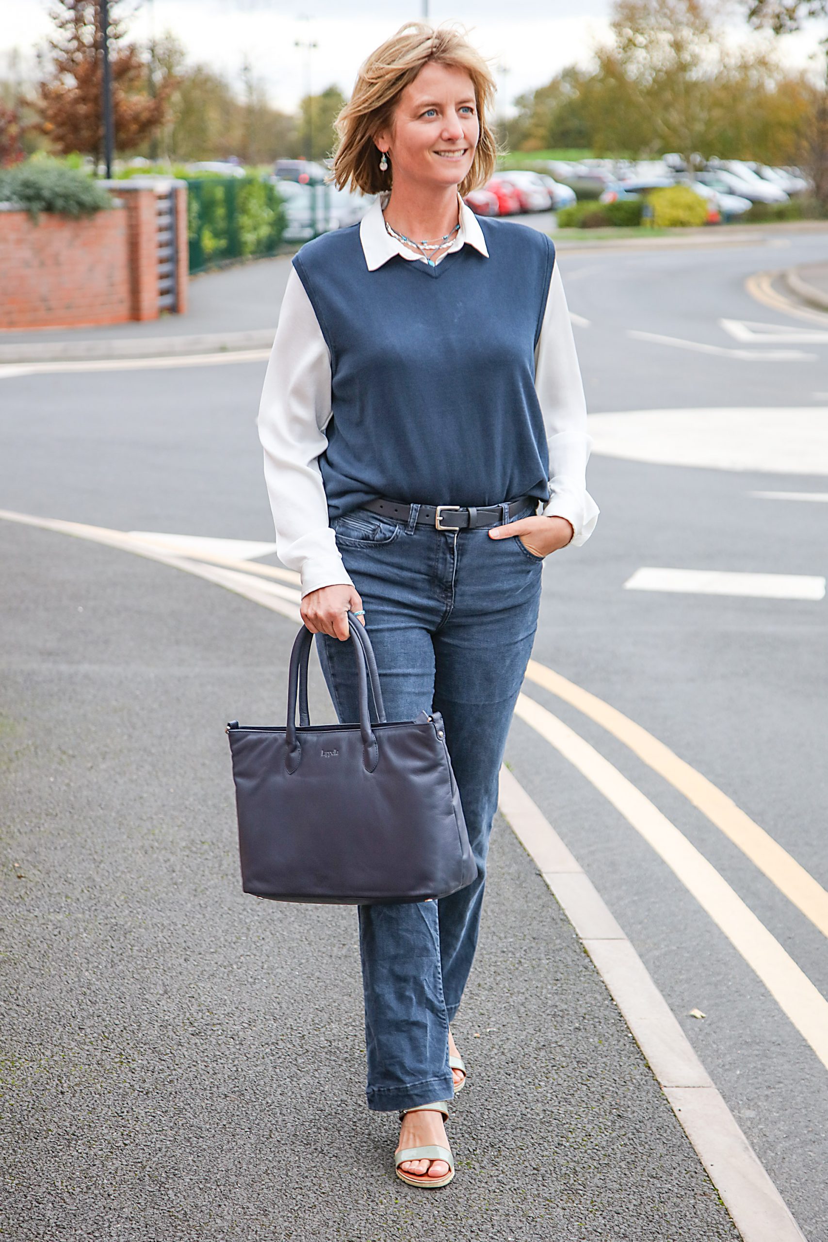 Lappella Luxury soft leather Kiera tote bag in navy . Lifestyle shot.