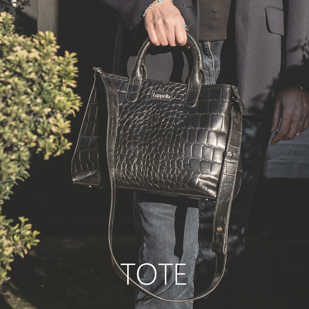 Thea tote bag in Luxury soft black croc leather. Lifestyle shot .