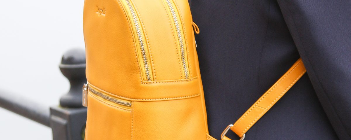 Nicole soft leather backpack in mustard. Lifestyle shot