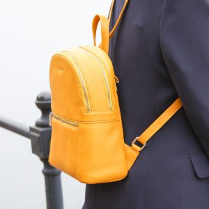 Nicole soft leather backpack in mustard. Lifestyle shot