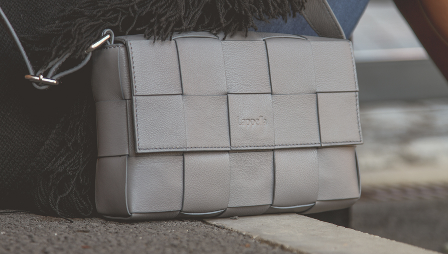 Grey soft leather Alicia crossbody bag lifestyle shot